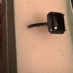 Elegant Black Stone Ring with crystals along the side of the band